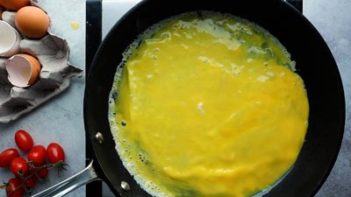 omelet cooking in a skillet