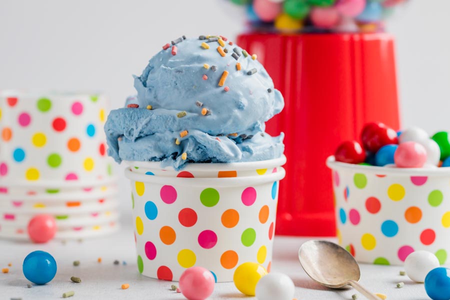 Keto blue bubble gum ice cream in a polka dot bowl