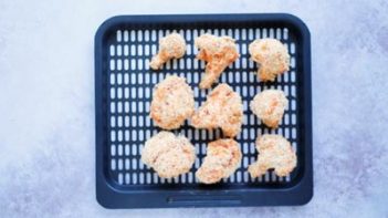 coated cauliflower sitting on a tray