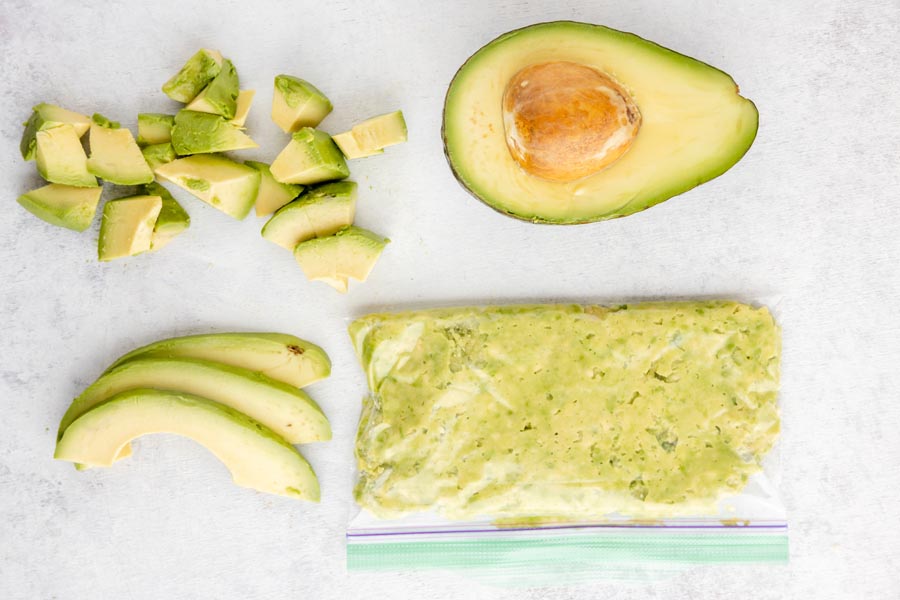 diced avocado, half avocado, sliced avocado and a baggie with mashed avocado