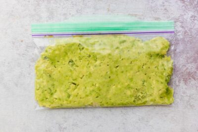 a small baggie with mashed avocado inside