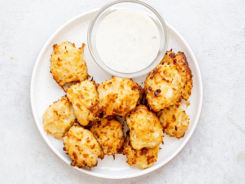 An overhead view of homemade canned chicken nuggets served with creamy ranch dressing for dipping.