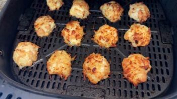Homemade canned chicken nuggets cooking in an air fryer until golden brown and crispy.