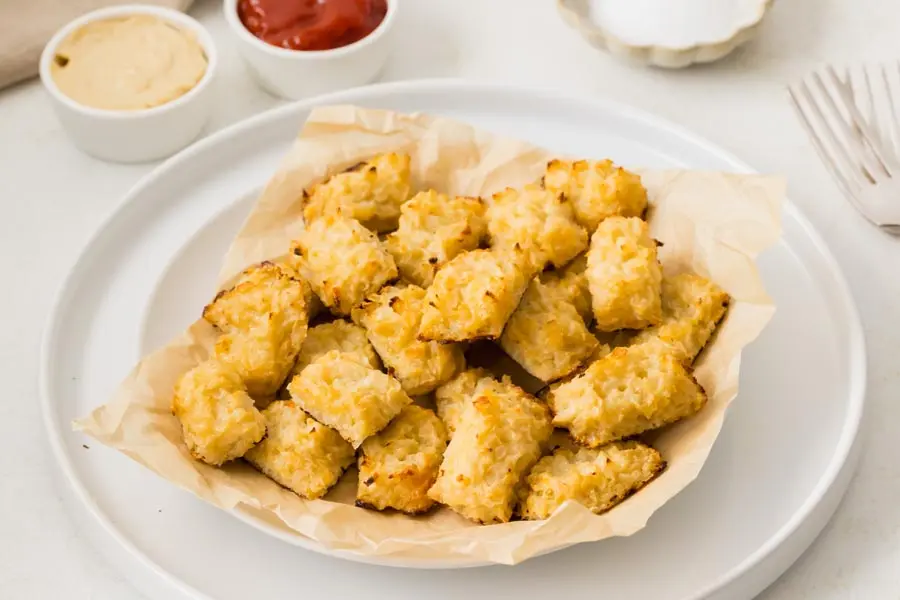 Extra crispy keto cheesy cauliflower tots served hot