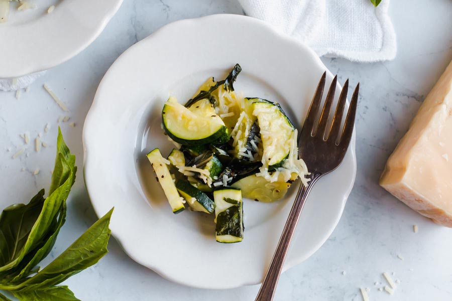 overhead of cheese melted on zucchini