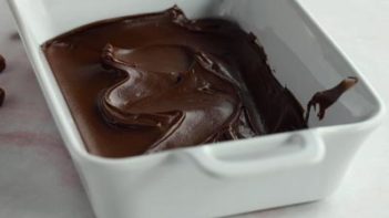 chocolate spread on the bottom of a white casserole dish