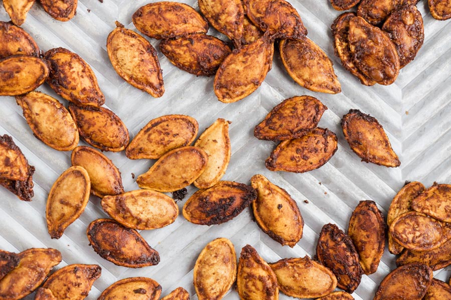 baked pumpkin seeds on a tray