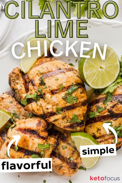 Juicy grilled chicken on a white plate and limes around.