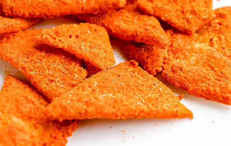 Close-up of crunchy cottage cheese chips showing their textured, seasoned surface.