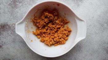 Seasoned cottage cheese dough resting in a bowl, ready to be shaped into chips.