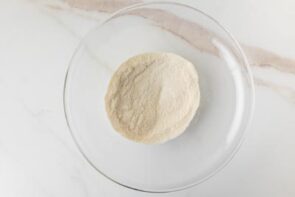 Dry ingredients for pancake mix in a glass bowl.