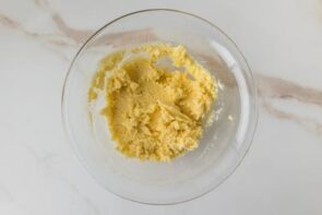 Low-carb cottage cheese pancake batter mixed until thick and smooth in a glass bowl.