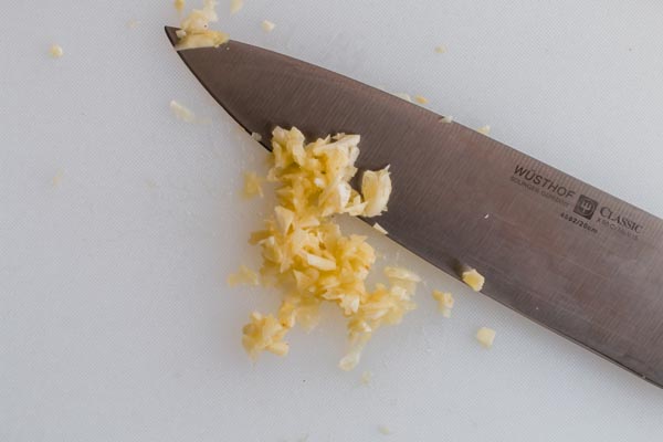 minced garlic and knife