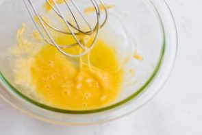 whisking egg yolk with garlic for form emulsion