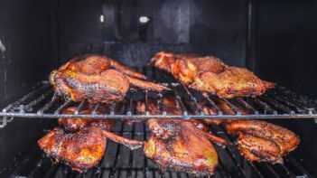 wings cooking in a smoker