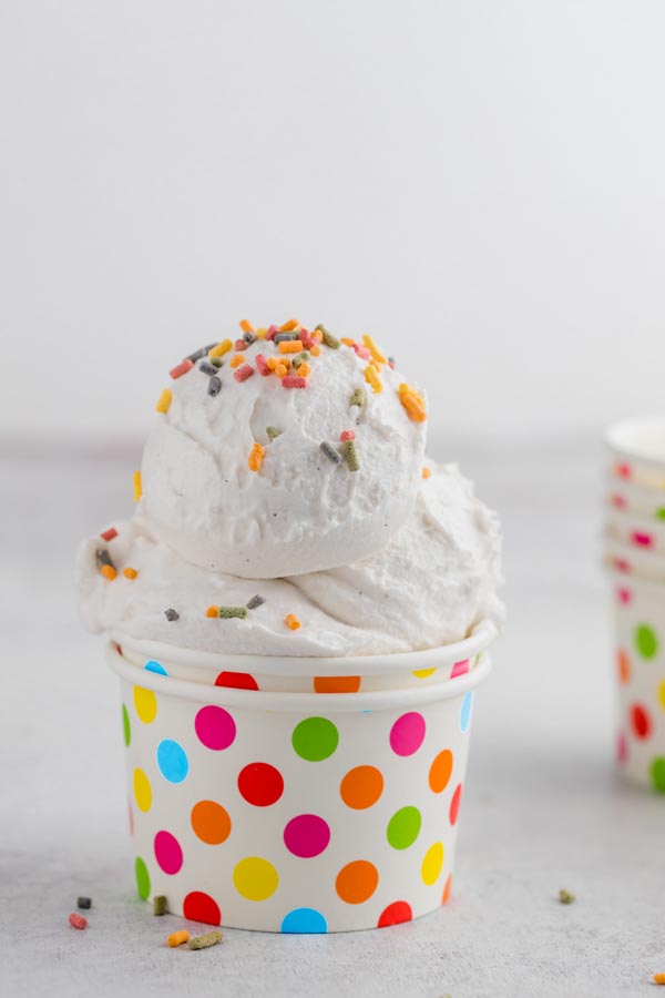 three scoops of dairy free ice cream in a polka dotted ice cream cup