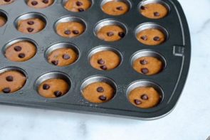 muffin batter in a mini muffin tin tray