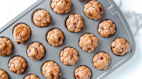 keto chocolate chip muffins baked and sitting in a muffin tin