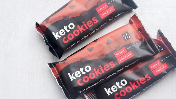 three packages of double chocolate cookies from perfect keto