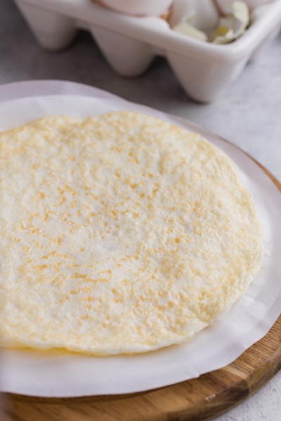 A wrap made out of eggs that resembles a tortilla.