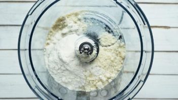 dry ingredients for pie crust in a food processor