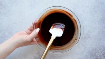 stirring melted chocolate with a spatula