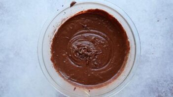 chocolate cake batter in a clear bowl
