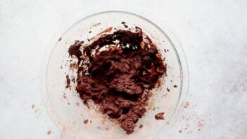 chocolate cookie dough in a clear glass bowl