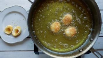 frying hardboiled egg whites in oil in a skillet