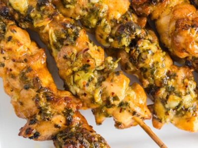 Close up of juicy, buttery parmesan garlic chicken skewers.