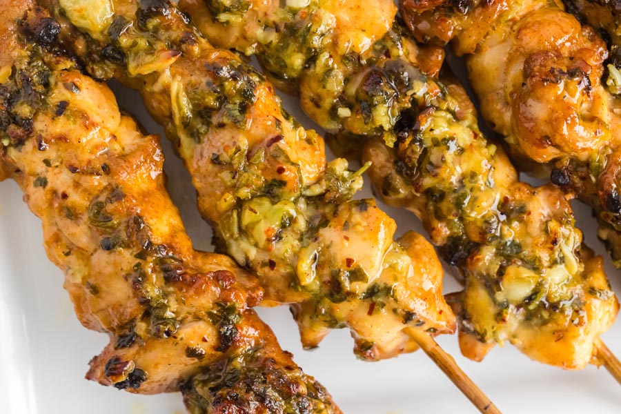 Close up of juicy, buttery parmesan garlic chicken skewers.