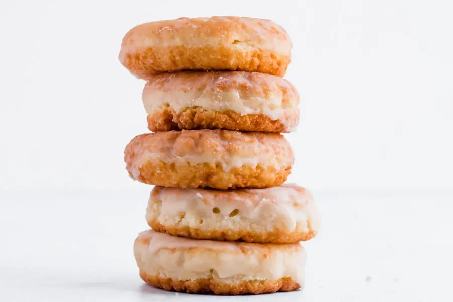 a large stack of glazed keto donuts