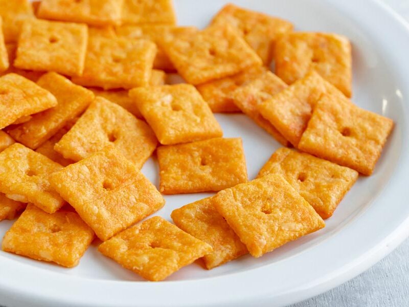 A plate of homemade cheez-its on a white plate.