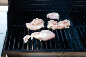 raw chicken on grill
