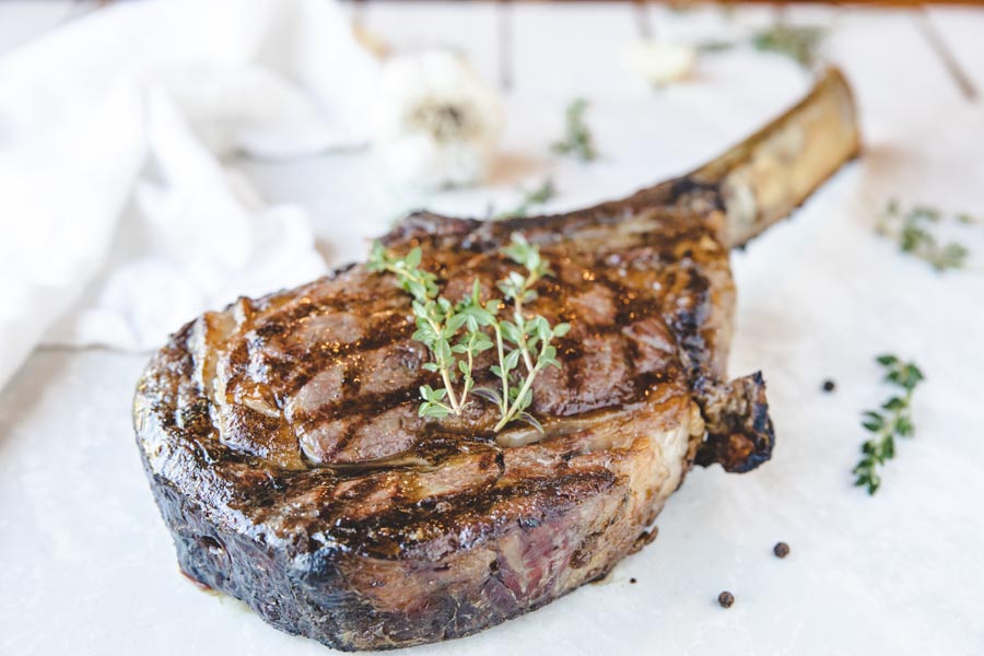 juicy steak with herbs on top