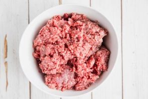 raw ground beef in a white bowl