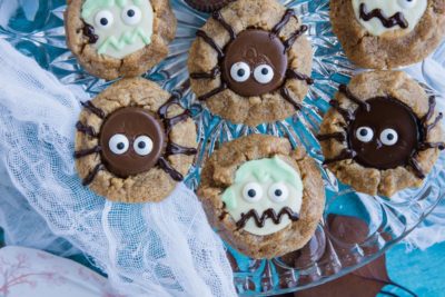 a tray with zombie and spider halloween cookies