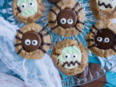 a tray with zombie and spider halloween cookies