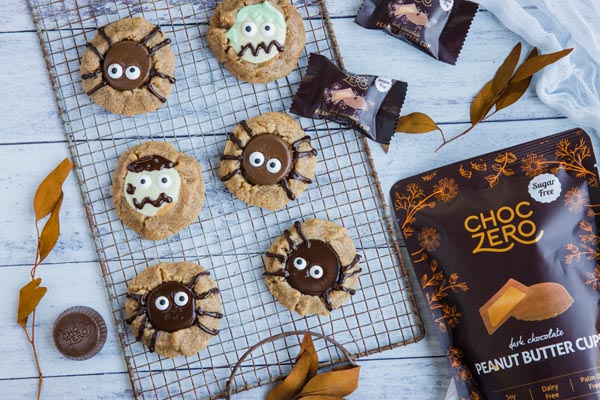 a bag of sugar-free peanut butter cups next to halloween peanut butter cup cookies