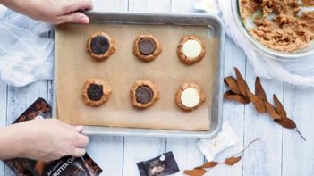 peanut butter cup pressed into a peanut butter cookie ball