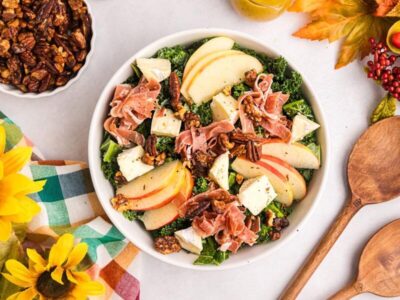 Kale harvest salad with apples, prosciutto, cheese and spiced pecans.