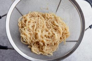 a colander with noodles inside