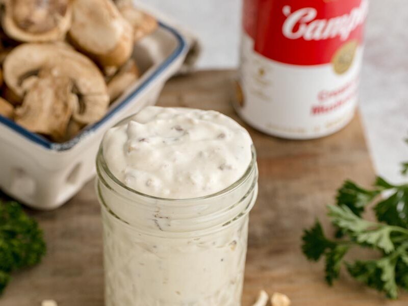 Close-up of thick and creamy homemade cream of mushroom soup with pieces of mushroom throughout.