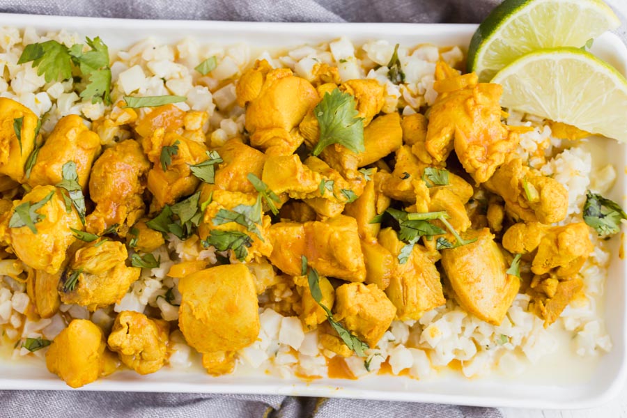 a plate of keto butter chicken with chopped cilantro spinkled on top