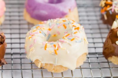 a white glazed donut with sprinkles