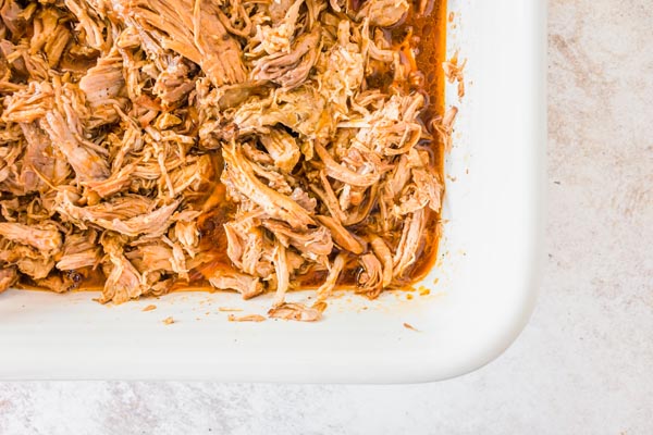 juicy pork shreds in a casserole dish