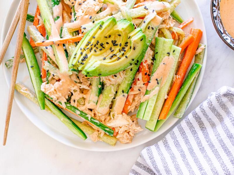Japanese kani salad with crab, julienned cucumber and carrots, avocado, spicy mayo, and black sesame seeds.