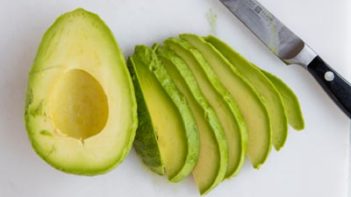avocado sliced up with a knife