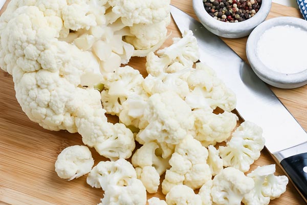 chopping up cauliflower florets