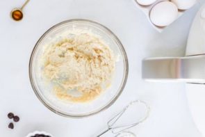 buttery mixture in a bowl next to an air fryer